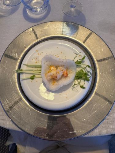 a plate with a piece of food on a table at L'ARCO E' DI FIO in Camaiore