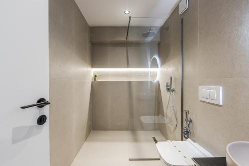 a bathroom with a shower and a sink at Zoe's Villa by PS in Durrës