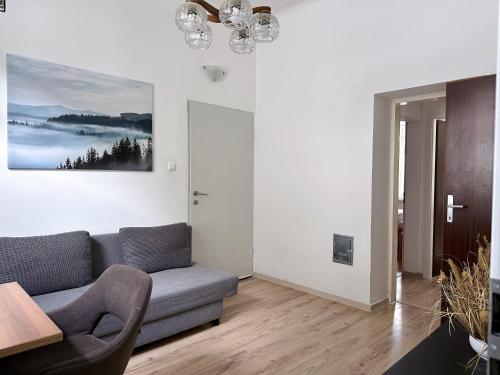 a living room with a couch and a table at Up Residences in Baden