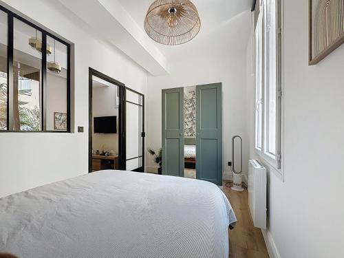 Katil atau katil-katil dalam bilik di Côté Palmier - Luxurious 2-room - Center-by PauseAixoise