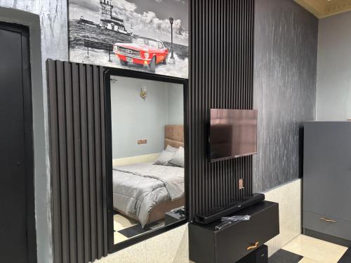 Кровать или кровати в номере Cityscape Apartment