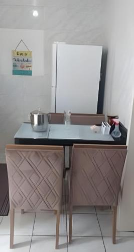 a kitchen with a table with a pot on it at Apartamento do centro in Caxias do Sul