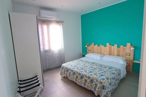 Ένα ή περισσότερα κρεβάτια σε δωμάτιο στο RineddaHouse Arenella - Vista Mare Panoramica a Palermo con Parcheggio privato
