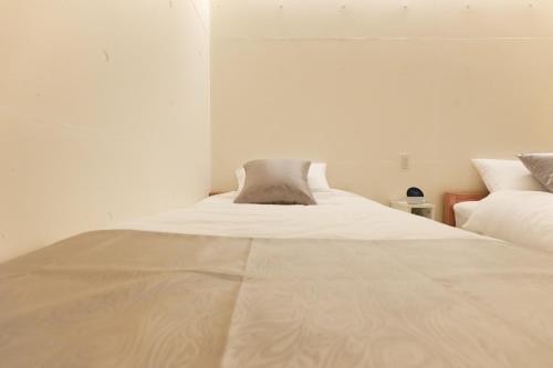 Cama o camas de una habitación en LOISIR Tateyama