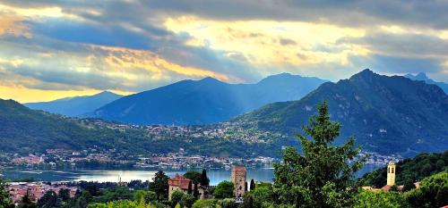 a view of a city with mountains and a lake at La Dimora Dei Due Laghi in Calolziocorte