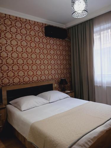 Postel nebo postele na pokoji v ubytování MANGO Guesthouse
