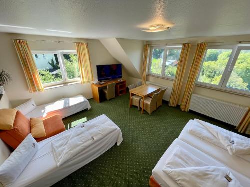 Postel nebo postele na pokoji v ubytování Berggasthof Hotel Igelwirt