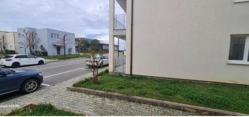 a building with a car parked on the side of a street at Villa Buki in Tale