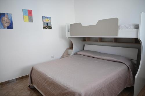 Ένα ή περισσότερα κρεβάτια σε δωμάτιο στο Casa vacanze Sonia
