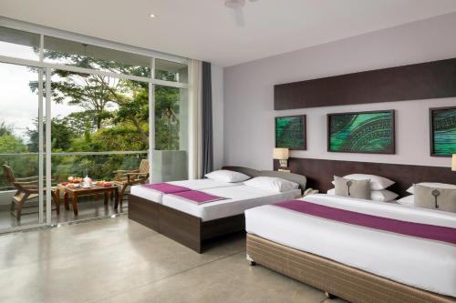 Postel nebo postele na pokoji v ubytování Skyloft Kandy by Aaradhya