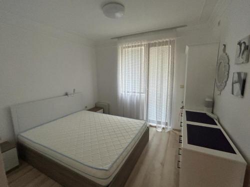 Postel nebo postele na pokoji v ubytování Ravda Apolon 9 Apartment