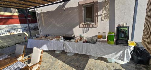 a table set up on the side of a building at GLIPTIS Apartments in Karfas