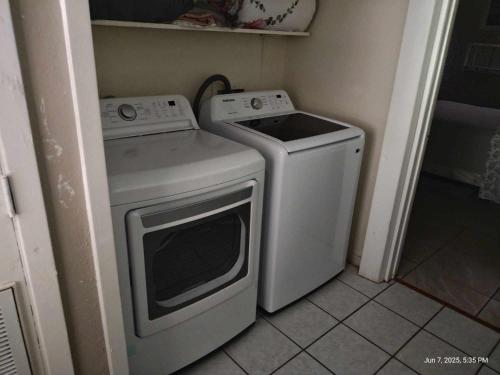 a washer and dryer in a small kitchen at Pure Country, plenty of space & trees, relaxing! in Lumberton