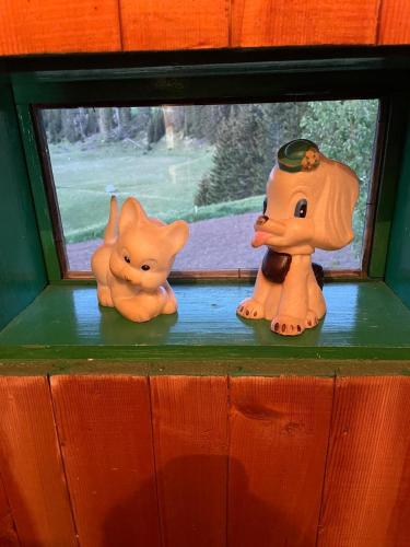 three toy animals sitting on a window sill at Domacinstvo Obradovic Nadgora 