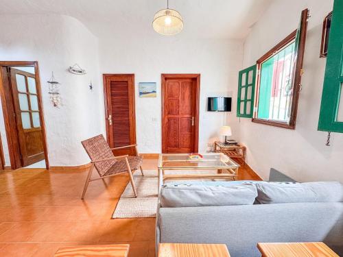 a living room with a couch and a table at Fee4Me 5 Min from Sardina Beach in Gáldar