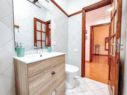 a bathroom with a sink and a toilet at Fee4Me 5 Min from Sardina Beach in Gáldar