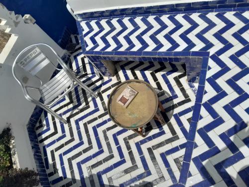 an overhead view of a table on a blue and white floor at Sky Blue in Tangier