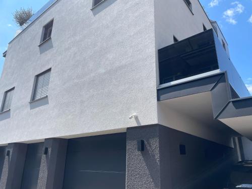 a white building with a window on the side of it at Apart Christine in Brixlegg