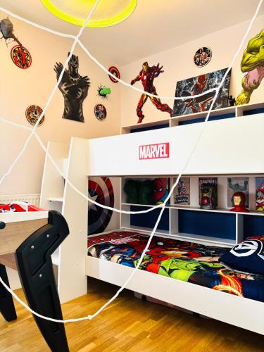 a childs room with a spider man bedroom with spider man stickers at THE ENCHANTED HOUSE ( 15 min walk to Disney) in Serris