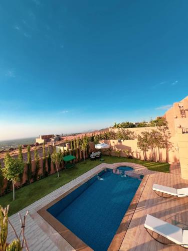 a swimming pool with a view of a resort at Ourika Luxury Villa in Ourika