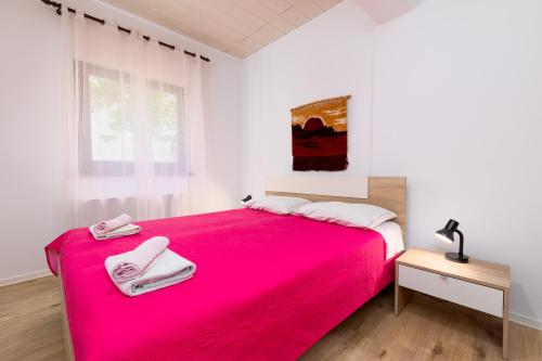 Postel nebo postele na pokoji v ubytování Apartments Snjezana by El-Pi Tours