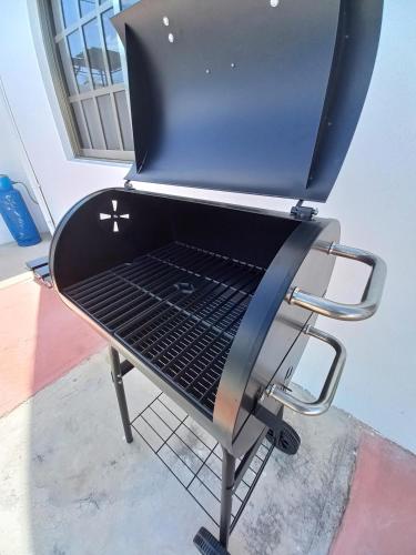 a barbecue grill sitting on top of a table at Modern villa with private pool, 1 block from the Ocean in Chicxulub