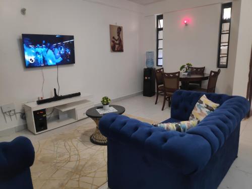 TV a/nebo společenská místnost v ubytování M & L Homes E7