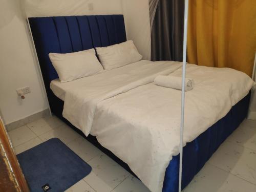 Postel nebo postele na pokoji v ubytování M & L Homes E7