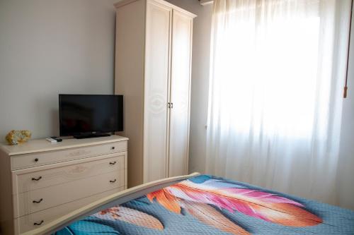 Ένα ή περισσότερα κρεβάτια σε δωμάτιο στο Camurria house