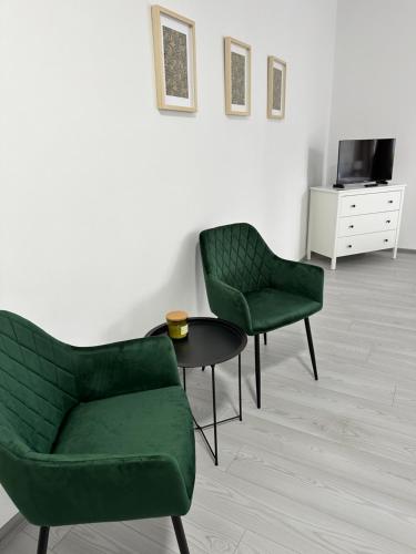 TV a/nebo společenská místnost v ubytování Apartmány Daros