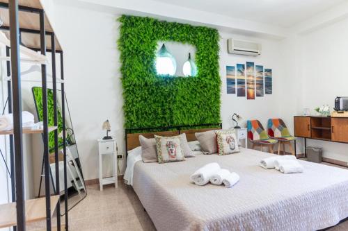 a bedroom with a bed with towels on it at Bed and Relax-Il Maniero in Calatabiano