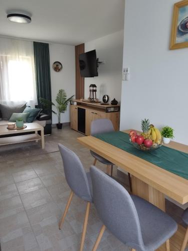 a living room with a table and chairs at Kuća za odmor Ria in Gornja Voća
