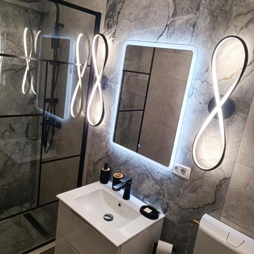 a bathroom with a sink and a mirror at Masarys 2 in Tulcea