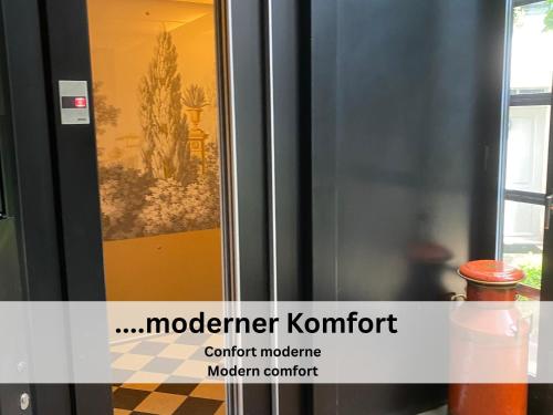 a picture of a painting on a glass door at Maison de Castella next to Cathedrale in Fribourg