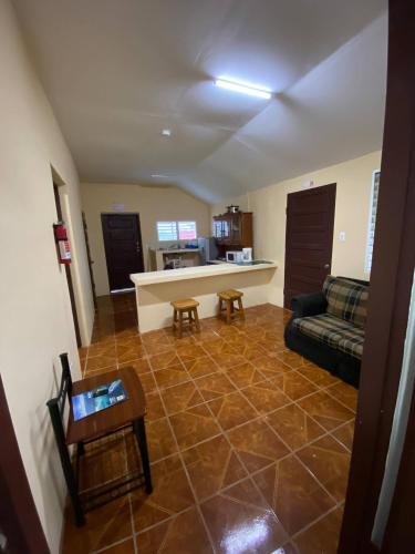 a living room with a couch and a table at Entire House - Private, Affordable, 10 mins to Itl Airport in Bakers