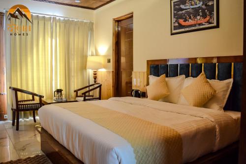 a bedroom with a large bed in a room at दोgri Homes in Kīar