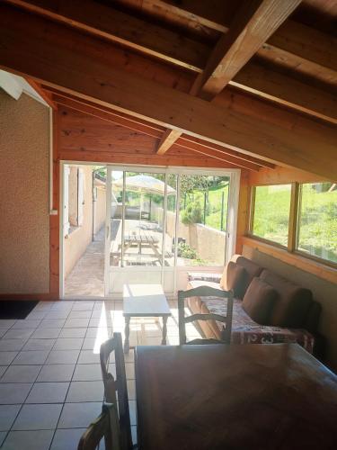 a living room with a couch and a table at Gite du Goulet in Montusclat