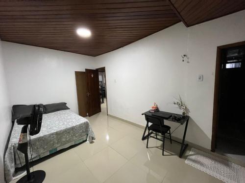 En eller flere senge i et værelse på Casa por temporada - Cop 30