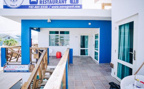 a view of the front porch of a house with blue walls at El Navegante de Culebra in Culebra