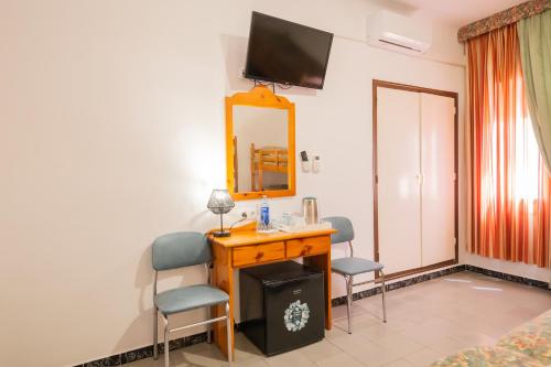 TV a/nebo společenská místnost v ubytování Hotel Montana by Bossh! Hotels