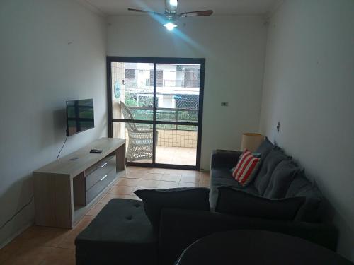 Khu vực ghế ngồi tại Apartamento no Guarujá-SP 8min andando até a praia