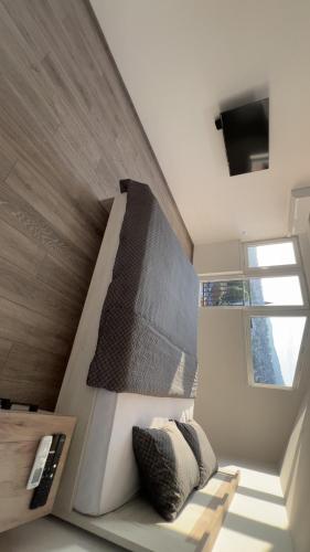 a living room with a couch and a window at Old Town Hideaway 2 in Sarajevo