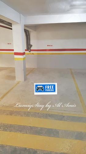 a free parking sign on the floor of a parking garage at LuxuryStay by Al Amir in Martil