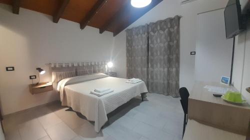 Кровать или кровати в номере Villa delle Fresie B&B