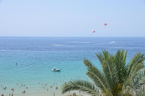 a group of people in the water at a beach at Apartamento PLAYA PEQUEÑA LUXURY in Benidorm
