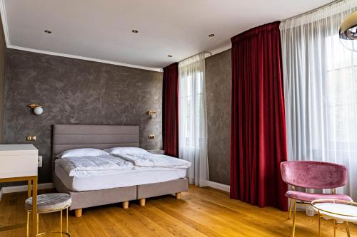 Posteľ alebo postele v izbe v ubytovaní Rosso Aparthotel