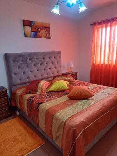 a bedroom with a large bed in a room at Casas da Boa Vista in Horta