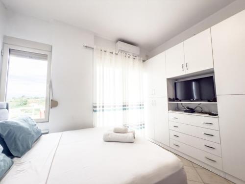 Postel nebo postele na pokoji v ubytování LunaSol seaside Apartments