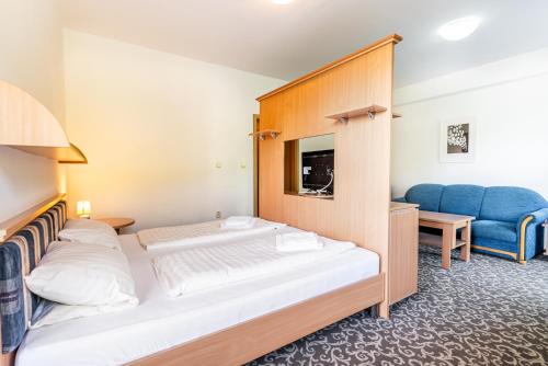 Una cama o camas en una habitación de Garni Hotel Gavurky