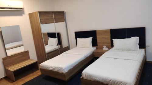 Postel nebo postele na pokoji v ubytování As Salam Apartment